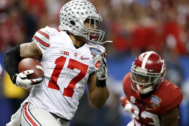 Ohio State running back Jalin Marshall (17) tries to get around Alabama defensive back Jabriel Washington (23) during a kick return in the first half of an NCAA college football game Thursday, Jan. 1, 2015, in New Orleans. (AP Photo/Butch Dill)