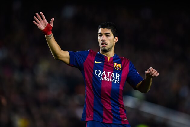 BARCELONA, SPAIN - DECEMBER 10:  Luis Suarez of FC Barcelona reacts during the UEFA Champions League group F match between FC Barcelona and Paris Saint-Germanin FC at Camp Nou Stadium on December 10, 2014 in Barcelona, Spain.  (Photo by David Ramos/Getty Images)