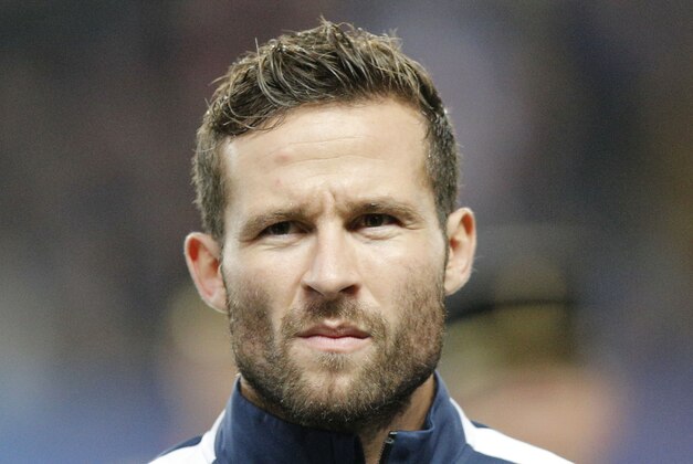 France's Yohan Cabaye, stands at attention during the Albanian National anthem prior to the start of a friendly soccer match France against Albania at Route de Lorient stadium in Rennes, western France, Friday, Nov. 14, 2014. The match ended in a 1-1 draw. (AP Photo/Michel Euler)