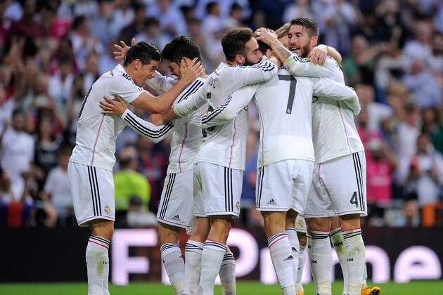 MADRID, SPAIN - OCTOBER 25:  James Rodriguez (L) of Real Madrid celebrates with Isco after Real scored their 3rd goal  during the La Liga match between Real Madrid CF and FC Barcelona at Estadio Santiago Bernabeu on October 25, 2014 in Madrid, Spain.  (Photo by Denis Doyle/Getty Images)
