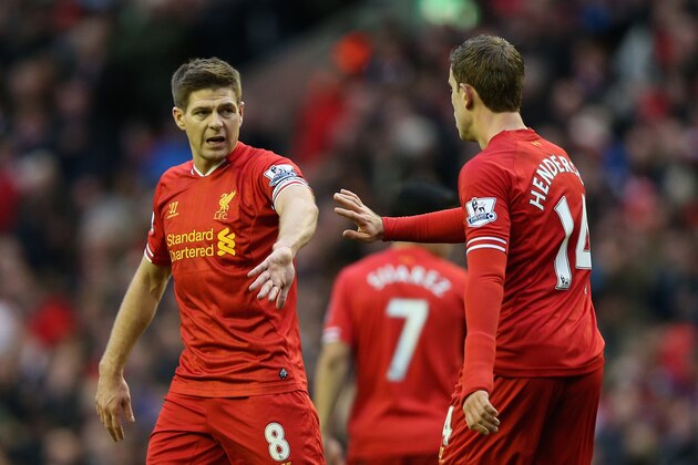 LIVERPOOL, ENGLAND - FEBRUARY 23:  Jordan Henderson of Liverpool celebrates scoring his team's fourth goal with his team-mate Steven Gerrard during the Barclays Premier League match between Liverpool and Swansea City at Anfield on February 23, 2014 in Liverpool, England.  (Photo by Clive Brunskill/Getty Images)