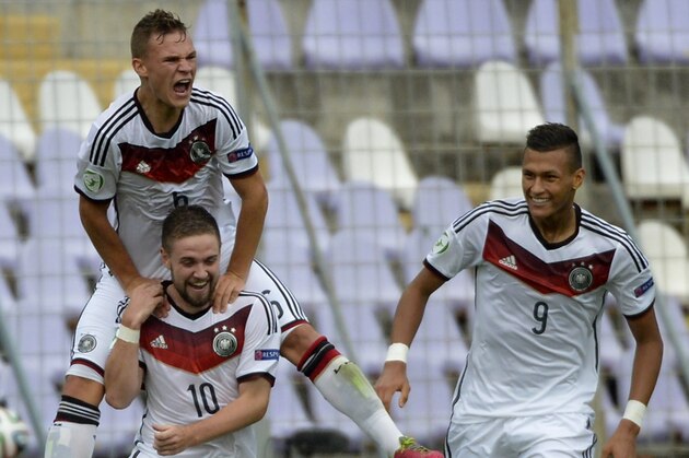 Marc Stendera of Germany, left no. 10, celebrates with teammates Joshua Kimmich, above, and Davie Selke after scoring against Austria during their U19 European Championship semifinal match in Szusza Ferenc Stadium in Budapest, Hungary, Monday July 28, 2014. (AP Photo/MTI, Tibor Illyes)