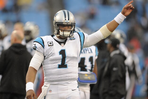 Carolina Panthers quarterback Cam Newton (1) warms up before an NFL wild card playoff football game against the Arizona Cardinals in Charlotte, N.C., Saturday, Jan. 3, 2015. (AP Photo/Mike McCarn)