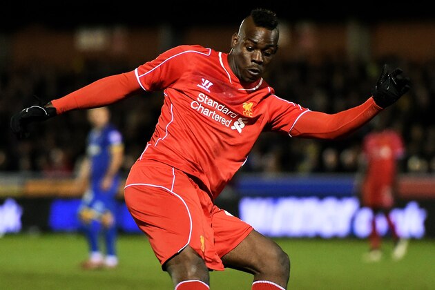 KINGSTON UPON THAMES, ENGLAND - JANUARY 05:  Mario Balotelli of Liverpool takes a shot on goal during the FA Cup Third Round match between AFC Wimbledon and Liverpool at The Cherry Red Records Stadium on January 5, 2015 in Kingston upon Thames, England.  (Photo by Michael Regan/Getty Images)