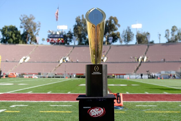 PASADENA, CA - JANUARY 01:  The National Championship Trophy presented by Dr. Pepper is seen on the field prior to the College Football Playoff Semifinal at the Rose Bowl Game presented by Northwestern Mutual at the Rose Bowl on January 1, 2015 in Pasadena, California.  (Photo by Kevork Djansezian/Getty Images)