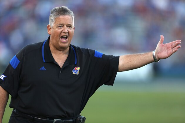 Kansas head coach Charlie Weis argues with an official after a penalty was called on his team during a game against Southeast Missouri State in the second quarter of an NCAA football game Saturday, Sept. 6, 2014, in Lawrence, Kan. (AP Photo/Ed Zurga)