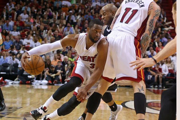 MIAMI, FL - JANUARY 04:  Dwyane Wade #3 of the Miami Heat drives to the basket during a game against the Brooklyn Nets at American Airlines Arena on January 4, 2015 in Miami, Florida. NOTE TO USER: User expressly acknowledges and agrees that, by downloading and/or using this photograph, user is consenting to the terms and conditions of the Getty Images License Agreement. Mandatory copyright notice:  (Photo by Mike Ehrmann/Getty Images)