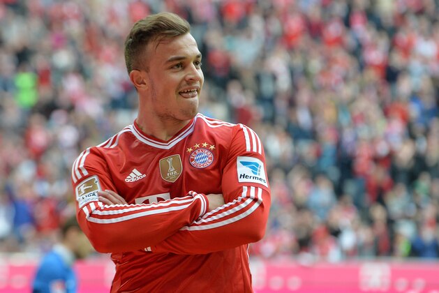 Bayern's Xherdan Shaqiri of Switzerland smiles after scoring during the German first division Bundesliga soccer match between FC Bayern Munich and SC Freiburg in Munich, Germany, on Saturday, Feb. 15, 2014. (AP Photo/Kerstin Joensson)