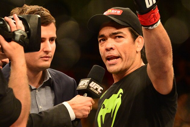 Dec 20, 2014; Barueri, SP, Brazil; Lyoto Machida (red gloves) celebrates after defeating C.B. Dollaway (blue gloves) during UFC Fight Night at Jose Correa Arena. Mandatory Credit: Jason Silva-USA TODAY Sports