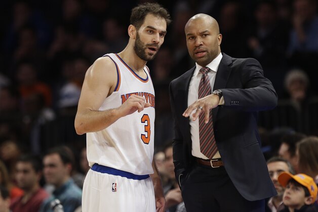 New York Knicks head coach Derek Fisher, right, talks to guard Jose Calderon (3), of Spain, during the second half of an NBA basketball game against the Detroit Pistons, Friday, Jan. 2, 2015, in New York. The Pistons won the game 97-81. (AP Photo/Frank Franklin II)