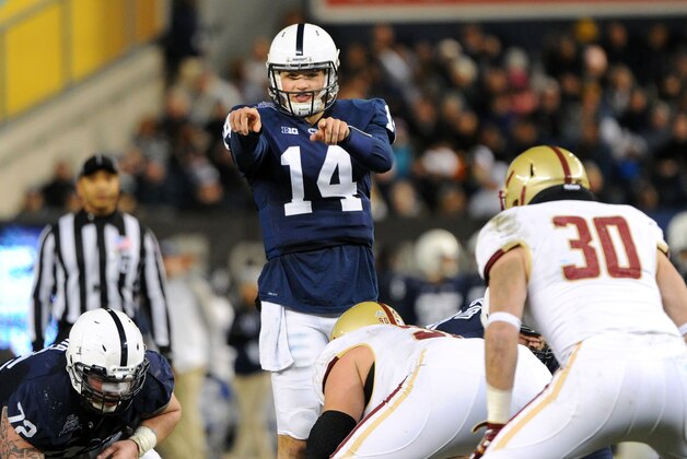 Dec 27, 2014; Bronx, NY, USA; Penn State Nittany Lions quarterback Christian Hackenberg (14) calls a play at the line against the Boston College Eagles during the first quarter in the 2014 Pinstripe Bowl at Yankee Stadium.  Mandatory Credit: Rich Barnes-USA TODAY Sports