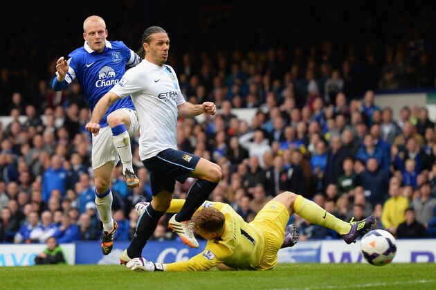 LIVERPOOL, ENGLAND - MAY 03:  Joe Hart of Manchester City saves the attempt on goal of Steven Naismith of Everton during the Barclays Premier League match between Everton and Manchester City at Goodison Park on May 3, 2014 in Liverpool, England.  (Photo by Laurence Griffiths/Getty Images)