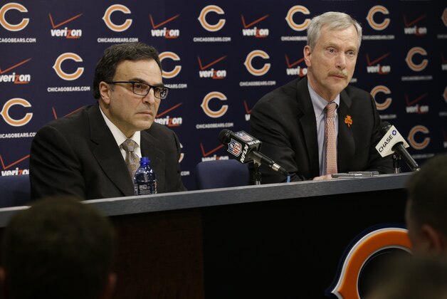 Chicago Bears President and CEO Ted Phillips, left, and Chairman George H. McCaskey listen to question at a news conference at Halas Hall on Monday, Dec. 29, 2014,  in Lake Forest, Ill. Chicago Bears head coach Marc Trestman and general manager Phil Emery were fired Monday after the team completed a disappointing 5-11 campaign.(AP Photo/Nam Y. Huh)