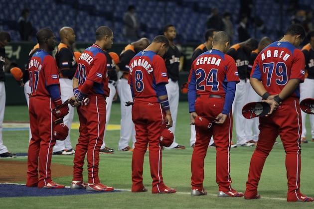 TOKYO, JAPAN - MARCH 11:  (L to R) Guillermo Heredia # 17, Yulieski Gourriel # 10, Jose Fernandez # 8, Frederich Cepeda # 24, Jose Abreu # 79 and Netherlands players pay silent tribute to mark Japan's second anniversary of the 2011 Magnitude 9.0 earthquake and sebsequent tsunami before the the World Baseball Classic Second Round Pool 1 game between Cuba and the Netherlands at Tokyo Dome on March 11, 2013 in Tokyo, Japan.  (Photo by Chung Sung-Jun/Getty Images)