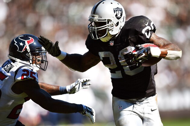 OAKLAND, CA - SEPTEMBER 14:  Darren McFadden #20 of the Oakland Raiders rushes for a one-yard touchdown against Kareem Jackson #25 of the Houston Texans during the third quarter at O.co Coliseum on September 14, 2014 in Oakland, California.  (Photo by Thearon W. Henderson/Getty Images)
