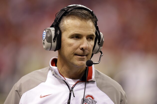 Ohio State head coach Urban Meyer watches from the sidelines during the second half of the Big Ten Conference championship NCAA college football game against Wisconsin Saturday, Dec. 6, 2014, in Indianapolis. (AP Photo/Darron Cummings)