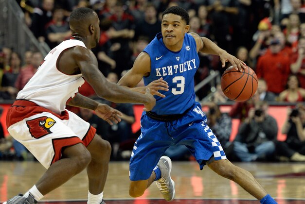 Dec 27, 2014; Louisville, KY, USA; Kentucky Wildcats guard Tyler Ulis (3) dribbles against Louisville Cardinals guard Chris Jones (3) during the first half at KFC Yum! Center. Kentucky defeated Louisville 58-50. Mandatory Credit: Jamie Rhodes-USA TODAY Sports Dec 27, 2014; Louisville, KY, USA; Kentucky Wildcats guard Tyler Ulis (3) dribbles against Louisville Cardinals guard Chris Jones (3) during the first half at KFC Yum! Center. Kentucky defeated Louisville 58-50. Mandatory Credit: Jamie Rhodes-USA TODAY Sports