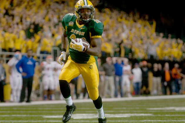 North Dakota State's John Crockett is alone during a long run early in the second half for a touchdown against Sam Houston State in the semifinals of the NCAA Football Championship Subdivision, Friday, Dec. 19, 2014, in Fargo, N.D. (AP Photo/Bruce Crummy)
