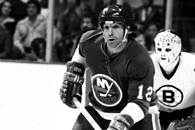 BOSTON, MA. - 1970's: J.P. Parise #12 of the  New York Islanders plays against the Boston Bruins .  (Photo by Steve Babineau/NHLI via Getty Images)