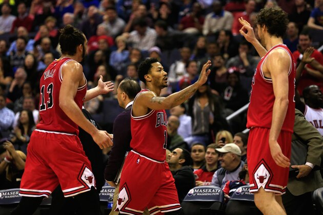 WASHINGTON, DC - DECEMBER 23: Derrick Rose #1 of the Chicago Bulls (C) celebrates after hitting a shot to end the first half with teammates Joakim Noah #13 and Pau Gasol #16 against the Washington Wizards at Verizon Center on December 23, 2014 in Washington, DC. NOTE TO USER: User expressly acknowledges and agrees that, by downloading and or using this photograph, User is consenting to the terms and conditions of the Getty Images License Agreement.  (Photo by Rob Carr/Getty Images)