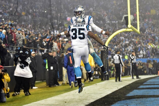Jan 3, 2015; Charlotte, NC, USA; Carolina Panthers fullback Mike Tolbert (35) celebrates with quarterback Cam Newton (1) after a touchdown during the third quarter against the Arizona Cardinals in the 2014 NFC Wild Card playoff football game at Bank of America Stadium. Mandatory Credit: Bob Donnan-USA TODAY Sports