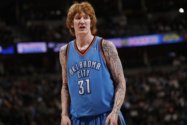 Oklahoma City Thunder center Robert Swift looks on against the Denver Nuggets in the third quarter of the Nuggets' 112-99 victory in an NBA basketball game in Denver on Wednesday, March 11, 2009. (AP Photo/David Zalubowski)