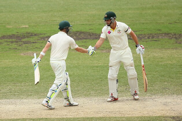 SYDNEY, AUSTRALIA - JANUARY 09:  Australian captain Steve Smith is congratulated by team mate Shaun Marsh after scoring fifty runs during day four of the Fourth Test match between Australia and India at Sydney Cricket Ground on January 9, 2015 in Sydney, Australia.  (Photo by Cameron Spencer/Getty Images)