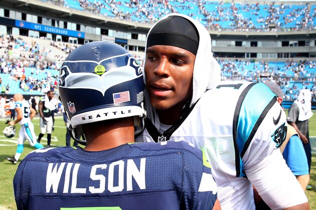 CHARLOTTE, NC - SEPTEMBER 08:   Cam Newton #1 of the Carolina Panthers congratulates Russell Wilson #3 of the Seattle Seahawks after their game at Bank of America Stadium on September 8, 2013 in Charlotte, North Carolina.  (Photo by Streeter Lecka/Getty Images)