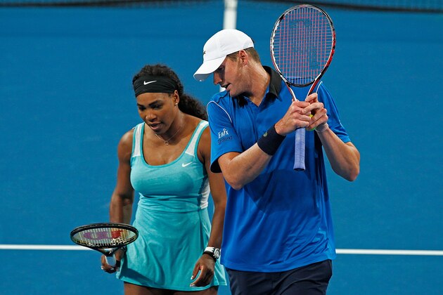 PERTH, AUSTRALIA - JANUARY 06:  John Isner and Serena Williams of the United States talk in-between serves in the mixed doubles match against Vasek Pospisil and Eugenie Bouchard of Canada during day three of the Hopman Cup at Perth Arena on January 6, 2015 in Perth, Australia.  (Photo by Will Russell/Getty Images)