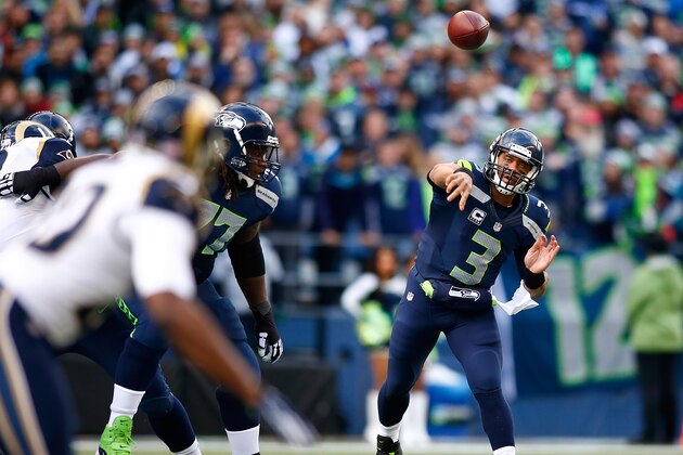 SEATTLE - DECEMBER 28:  Quarterback Russell Wilson #3 of the Seattle Seahawks throws a pass against the St. Louis Rams at CenturyLink Field on December 28, 2014 in Seattle, Washington.  (Photo by Jonathan Ferrey/Getty Images)
