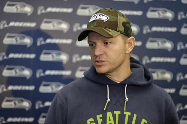 Seattle Seahawks offensive coordinator Darrell Bevell talks to reporters on Wednesday, Jan. 15, 2014, after NFL football practice in Renton, Wash. The Seahawks are to play the San Francisco 49ers on Sunday in the NFC championship. (AP Photo/Ted S. Warren)