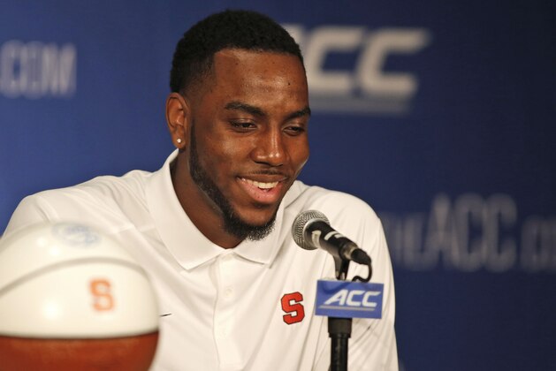 Syracuse basketball player Rakeem Christmas answers a question at the Atlantic Coast Conference NCAA college basketball media day in Charlotte, N.C., Wednesday, Oct. 29, 2014. (AP Photo/Nell Redmond)