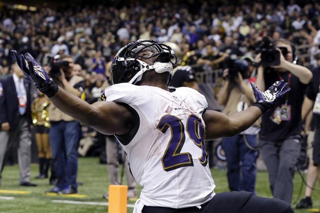 FILE - In this Nov. 24, 2014, file photo, Baltimore Ravens running back Justin Forsett celebrates his touchdown run in the second half of an NFL football game against the New Orleans Saints in New Orleans. Forsett, he's been magical, juicing up the Baltimore offense with a combination of the steady and the spectacular. (AP Photo/Jonathan Bachman, File)