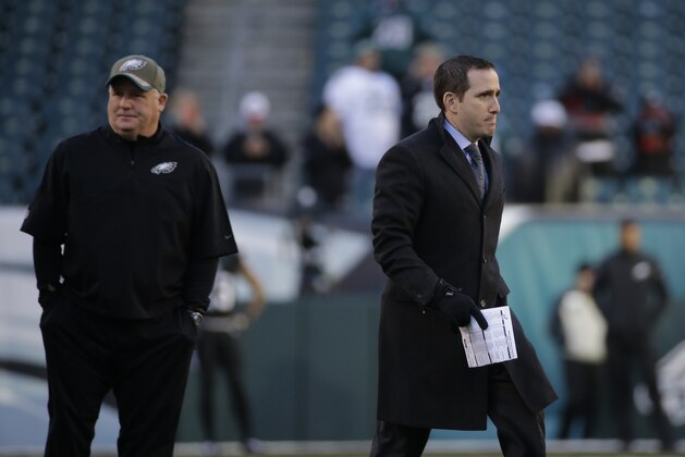 Philadelphia Eagles General Manager Howie Roseman, right,  walks the field as Philadelphia Eagles head coach Chip Kelly stands by before an NFL football game against the Seattle Seahawks, Sunday, Dec. 7, 2014, in Philadelphia. (AP Photo/Michael Perez)
