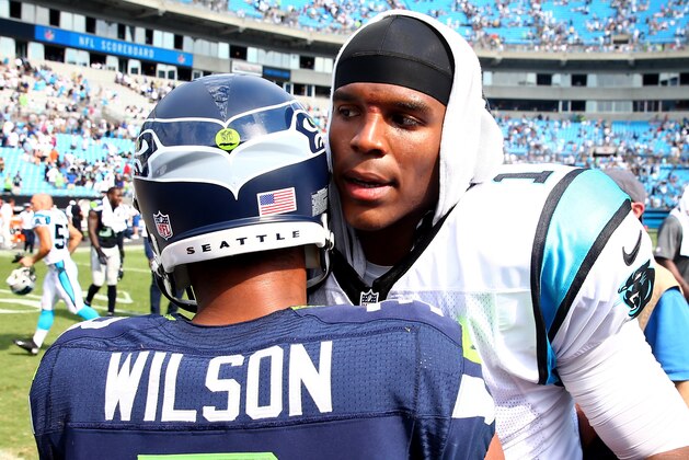 CHARLOTTE, NC - SEPTEMBER 08:   Cam Newton #1 of the Carolina Panthers congratulates Russell Wilson #3 of the Seattle Seahawks after their game at Bank of America Stadium on September 8, 2013 in Charlotte, North Carolina.  (Photo by Streeter Lecka/Getty Images)