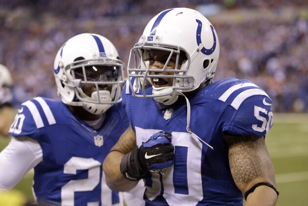 Indianapolis Colts linebacker Jerrell Freeman, right, celebrates along side teammate Darius Butler during the second half of an NFL wildcard playoff football game Sunday, Jan. 4, 2015, in Indianapolis. (AP Photo/AJ Mast)