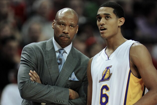 Los Angeles Lakers head coach Byron Scott, left, talks with Los Angeles Lakers' Jordan Clarkson (6) during the second half of an NBA basketball game against the Chicago Bulls in Chicago, Thursday, Dec. 25, 2014. Chicago won 113-93. (AP Photo/Paul Beaty)