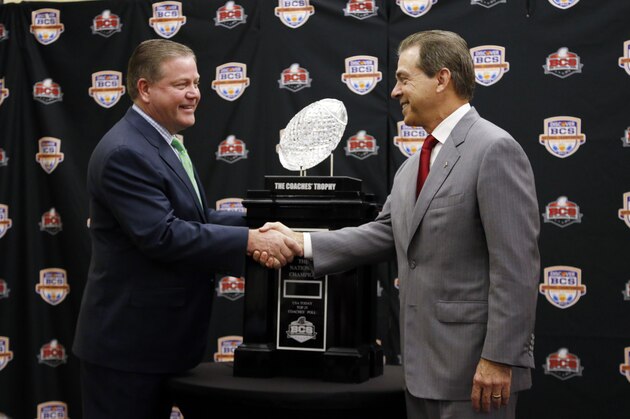 Alabama head coach Nick Saban and Notre Dame head coach Brian Kelly pose with The Coaches' Trophy during a news conference for the BCS National Championship college football game Sunday, Jan. 6, 2013, in Miami. (AP Photo/John Bazemore)