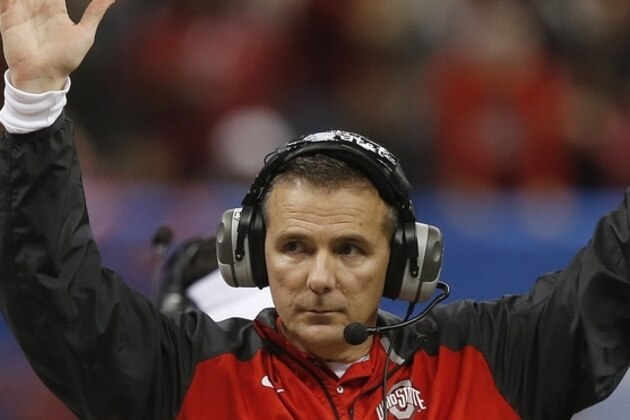 Ohio State head coach Urban Meyer indicates a Ohio State touchdown by wide receiver Michael Thomas in the first half of the Sugar Bowl NCAA college football playoff semifinal game against Alabama, Thursday, Jan. 1, 2015, in New Orleans. (AP Photo/Bill Haber)