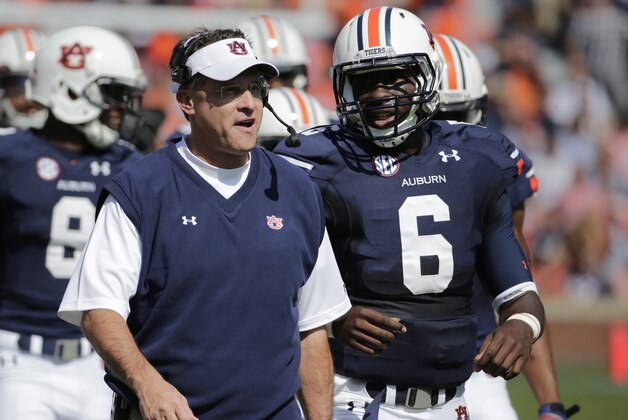 Auburn head coach Gus Malzahn talks with Auburn quarterback Jeremy Johnson (6) in the first half of an NCAA college football game in Auburn, Ala., Saturday, Oct. 12, 2013. (AP Photo/Dave Martin)