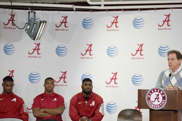 Alabama head coach Nick Saban talks about how proud he is of T.J. Yeldon, left, Amari Cooper, center, and Landon Collins, right, for declaring their decision to enter the NFL draft during a press conference, Friday, Jan. 9, 2015, in Tuscaloosa, Ala. Saban said that it speaks highly of the Alabama program to have players enter the NFL draft. (AP Photo/Brynn Anderson)