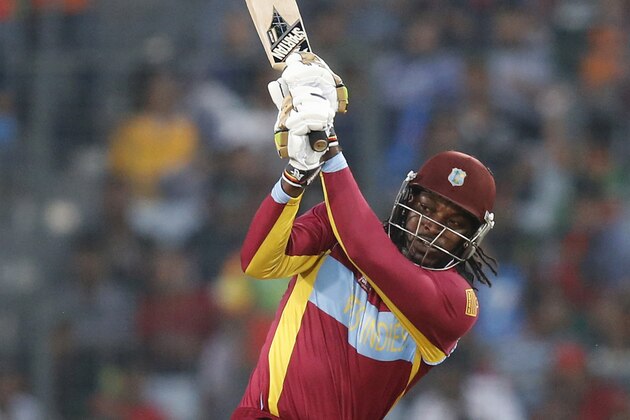West Indies' batsman Chris Gayle watches his shot during the ICC Twenty20 Cricket World Cup match against Australia in Dhaka, Bangladesh, Friday, March 28, 2014. (AP Photo/Aijaz Rahi)