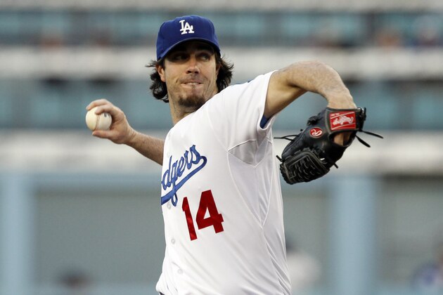 Los Angeles Dodgers starting pitcher Dan Haren throws to the plate in the first inning against the Colorado Rockies in a baseball game Saturday, Sept. 27, 2014, in Los Angeles. (AP Photo/Alex Gallardo)