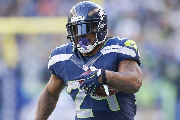 Nov 23, 2014; Seattle, WA, USA; Seattle Seahawks running back Marshawn Lynch (24) runs for yards after the catch against the Arizona Cardinals during the third quarter at CenturyLink Field. Mandatory Credit: Joe Nicholson-USA TODAY Sports