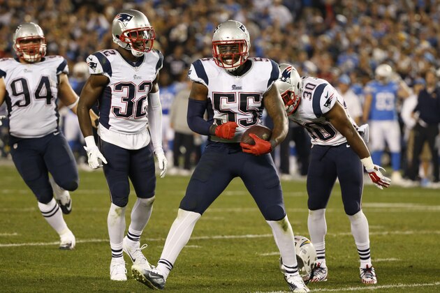 New England Patriots outside linebacker Akeem Ayers (55) celebrates his interception against the San Diego Chargers during the second half in an NFL football game Sunday, Dec. 7, 2014, in San Diego. (AP Photo/Lenny Ignelzi)