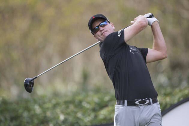 Zach Johnson tees off from the 17th hole during the final round of the Hero World Challenge golf tournament on Sunday, Dec. 7, 2014, in Windermere, Fla. (AP Photo/Willie J. Allen Jr.)