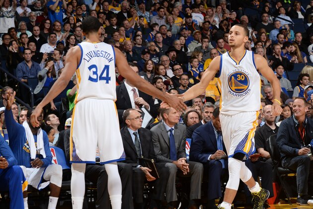 OAKLAND, CA - JANUARY 9: Shaun Livingston #34 and Stephen Curry #11 of the Golden State Warriors celebrate during the game against the Cleveland Cavaliers on January 9, 2015 at Oracle Arena in Oakland, California. NOTE TO USER: User expressly acknowledges and agrees that, by downloading and or using this photograph, user is consenting to the terms and conditions of Getty Images License Agreement. Mandatory Copyright Notice: Copyright 2015 NBAE (Photo by Noah Graham/NBAE via Getty Images)