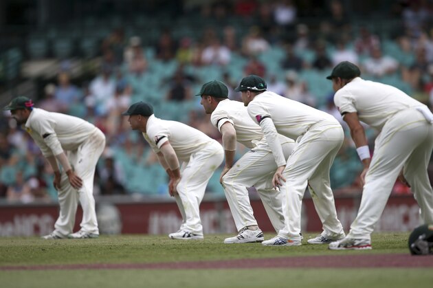 Australian players Nathan Lyon, left, David Warner, second left, Shaun Marsh, Steve Smith, second right, and Shane Watson, right, line up in the slips to field against India on the fifth day of their cricket test match in Sydney, Saturday, Jan. 10, 2015. (AP Photo/Rick Rycroft)