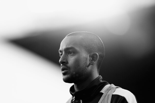 LONDON, ENGLAND - DECEMBER 28:  (EDITORS NOTE: Image has been converted to black and white.) Theo Walcott of Arsenal looks on during the Barclays Premier League match between West Ham United and Arsenal at Boleyn Ground on December 28, 2014 in London, England.  (Photo by Julian Finney/Getty Images)