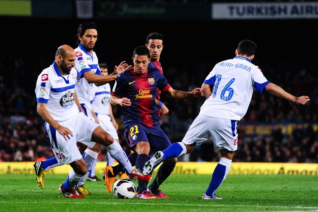 BARCELONA, SPAIN - MARCH 09: Adriano Correia of FC Barcelona (C) duels for the ball with Bruno Gama (R) and Manuel Pablo of RC Deportivo La Coruna during the La Liga match between FC Barcelona and RC Deportivo La Coruna at Camp Nou on March 9, 2013 in Barcelona, Spain.  (Photo by David Ramos/Getty Images)